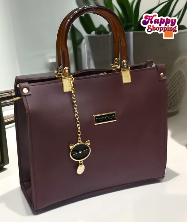 Elegant Handbag with Cat Charm and Acrylic Handles