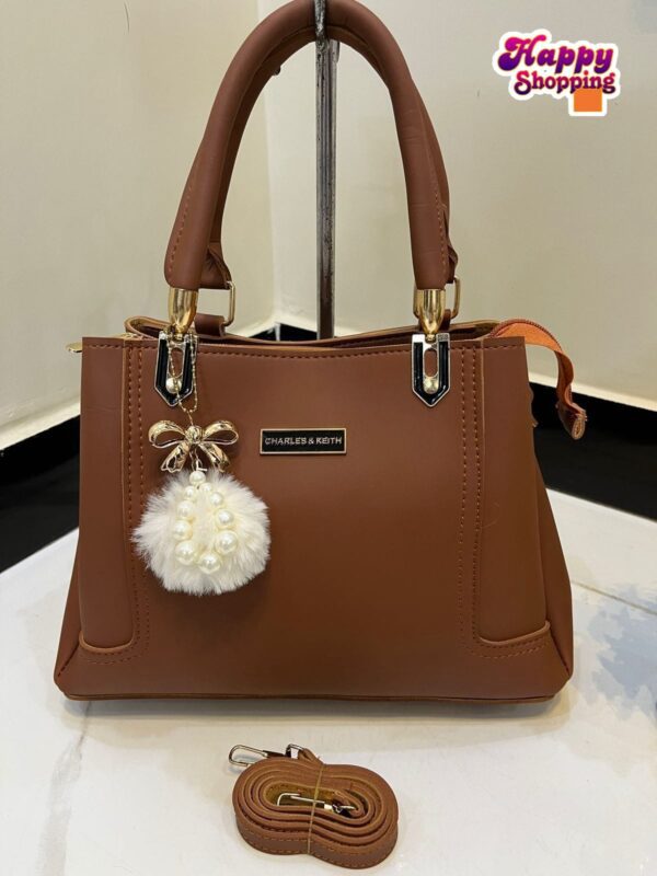 Elegant Handbag with Pearl Charm & Adjustable Strap – Charles & Keith Design