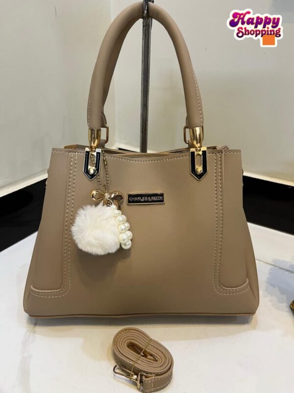 Elegant Handbag with Pearl Charm & Adjustable Strap – Charles & Keith Design