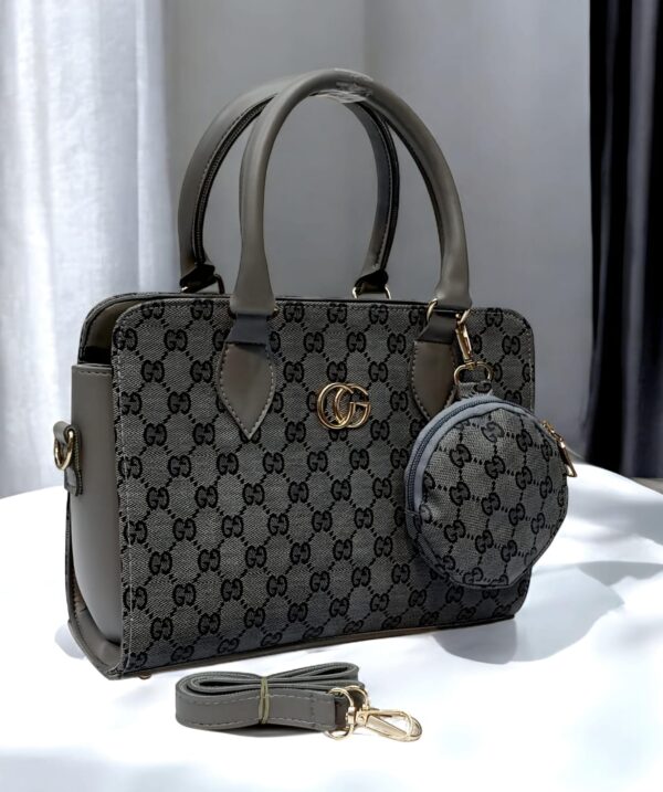 Luxury Branded Handbag With Round Pouch And Adjustable Strap