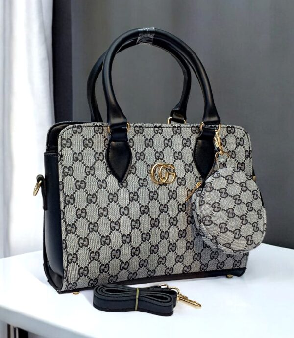 Luxury Branded Handbag With Round Pouch And Adjustable Strap