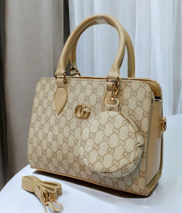 Luxury Branded Handbag With Round Pouch And Adjustable Strap