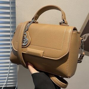Elegant Textured Leather Handbag With Chain Charm Accent