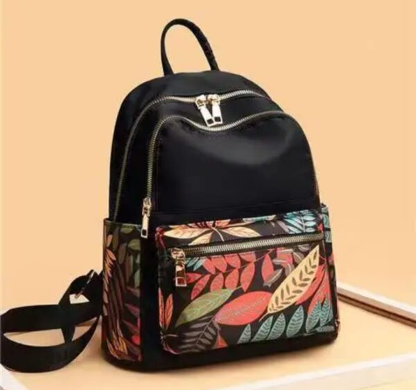 Modern Leaf-Patterned Backpack with Dual Zippers and Front Pocket
