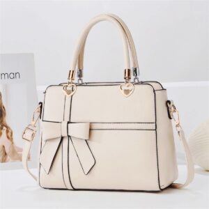 Elegant Bow-adorned Satchel Handbag With Heart Charm Handles And Removable Shoulder Strap