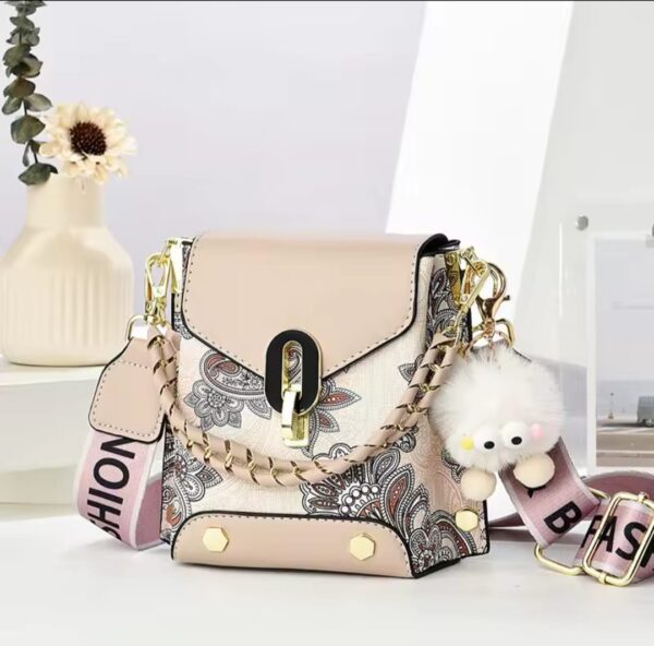 Trendy Floral Crossbody Bag with Chain Detail and Plush Charm