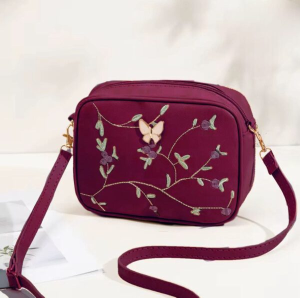 Floral Charm Crossbody Bag with Elegant Butterfly Accent
