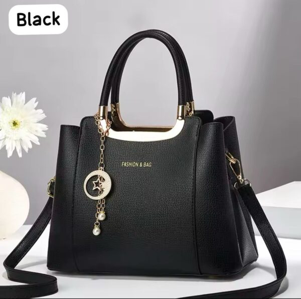 Elegant Handbag with Star Charm Pendant and Structured Design