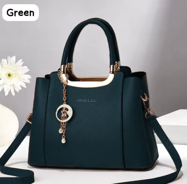 Elegant Handbag with Star Charm Pendant and Structured Design