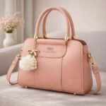 Structured Satchel with Bow-Accent Charm and Detachable Strap