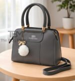 Structured Satchel with Bow-Accent Charm and Detachable Strap