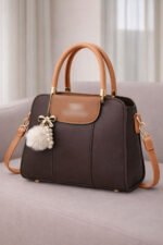 Elegant Dual Tone Handbag With Pom Pom Charm