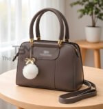 Structured Satchel with Bow-Accent Charm and Detachable Strap
