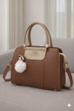 Elegant Dual Tone Handbag With Pom Pom Charm