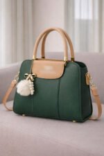 Elegant Dual Tone Handbag With Pom Pom Charm