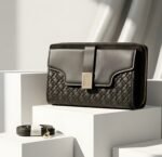Luxe Quilted Zippered Clutch With Signature Metallic Clasp And Crossbody Strap