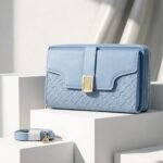 Luxe Quilted Zippered Clutch With Signature Metallic Clasp And Crossbody Strap