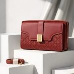 Luxe Quilted Zippered Clutch With Signature Metallic Clasp And Crossbody Strap