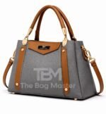 Structured Satchel With Contrast Panel Accents And Polished Hardware