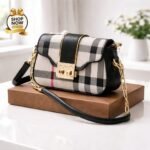 Heritage Plaid Flap Bag With Iconic Gold Tone Clasp And Chain Link Strap