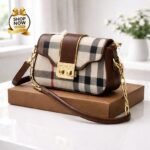 Heritage Plaid Flap Bag With Iconic Gold Tone Clasp And Chain Link Strap