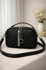 Woven Ruched Crossbody Bag With Metallic Tassel Charm And Dual Handles