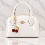 Patent Leather Dome Satchel Handbag With Cherry Charm - Image 8
