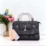 Marble Textured Crossbody Bag with Bow & Clover Charm Accent